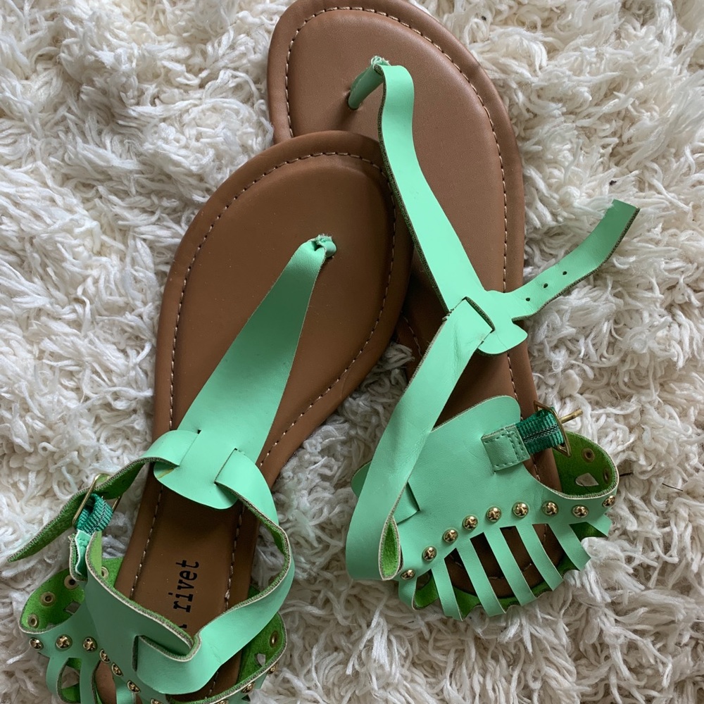 Teal colored gladiator sandals with gold details